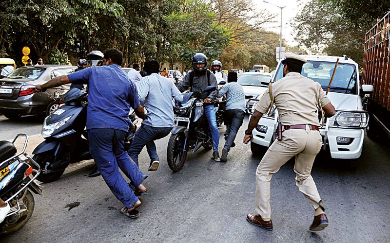 Miscreants vandalising cars near the jail.