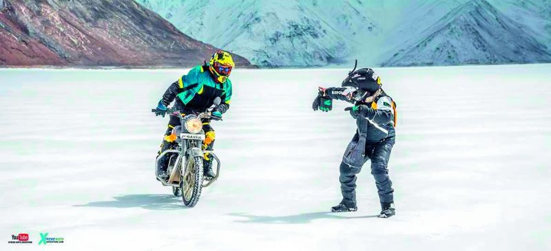 The team members having fun on the frozen Pangong Lake