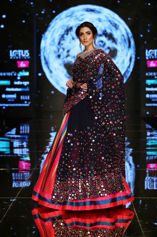 Abstract mirror work makes the lehenga look bright and beautiful. (Photo: FDCI)