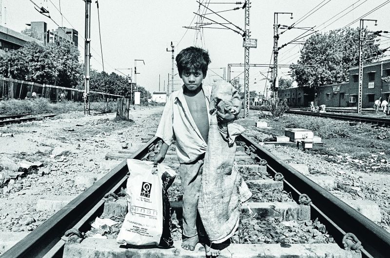 Kid at a railway track.