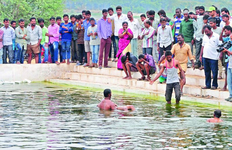 Police recovers the body of M. Vikas from the Bathukamma Ghat on Necklace Road. Vikas and three of his friends had gone to the Ghat to swim. (Photo: DC)
