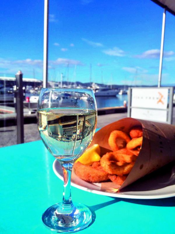 Indulge in some fresh seafood and wine at the Hobart waterfront.