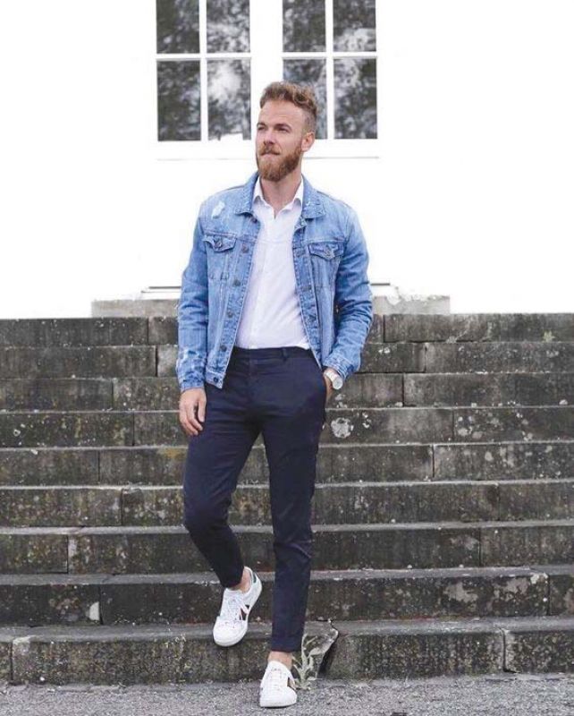 White shirt with denim jacket and white sneakers brings out the macho in you