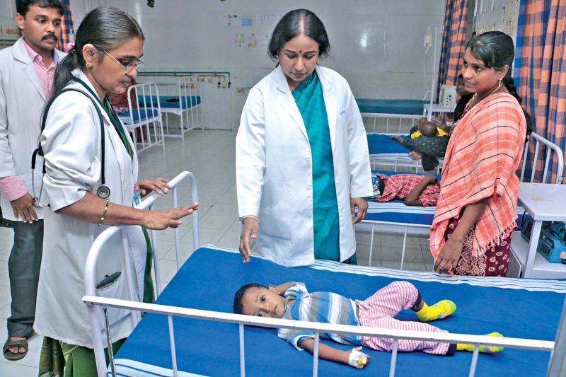 Dean Dr R. Jayanti checks on dengue affected children at Government Kasturba Gandhi Hospital in Triplicane on Thursday. (Photo: DC)