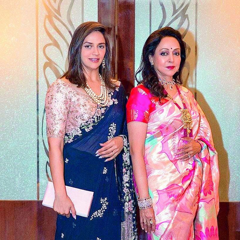 Hema Malini put up a picture on Instagram after attending Isha Ambani's wedding, crediting @warp and Weft for the saree she was wearing