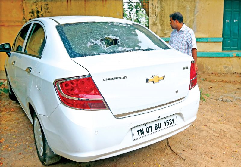 The rear windshield of Principal Kaliraj's car damaged in the stone pelting. (Photo: DC)