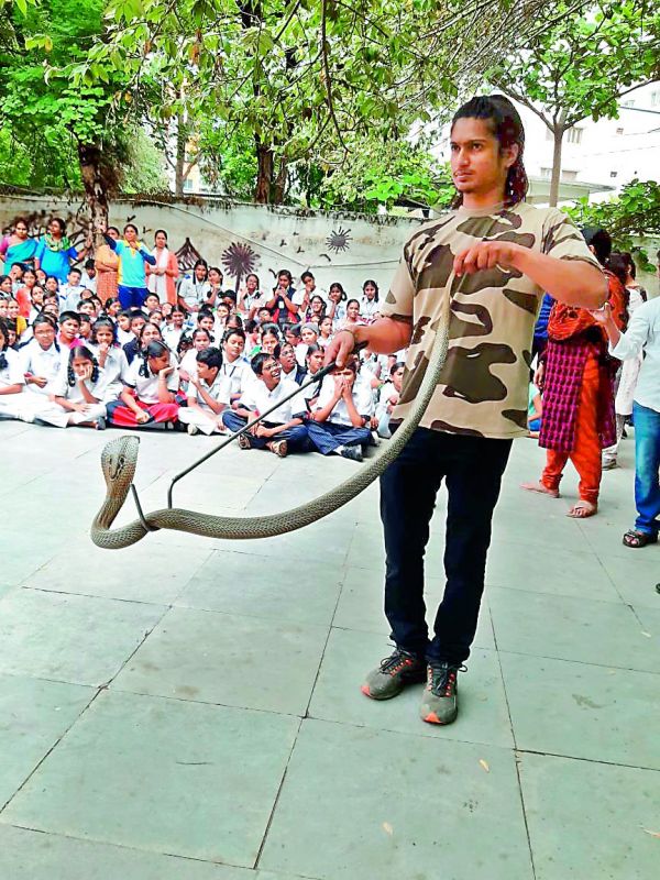 Abhishek from Friends of Snakes Society during an awareness porgramme