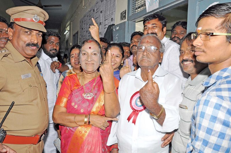 AIADMK candidate E. Madhusudhanan poses for camera after casting his vote in Washermenpet. (Photo: DC)