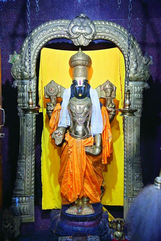 Standing tall: The idol of Lord Venkateswara, which is from Tirupathi while the brass body armour is from a devotee. (Photo: DC)