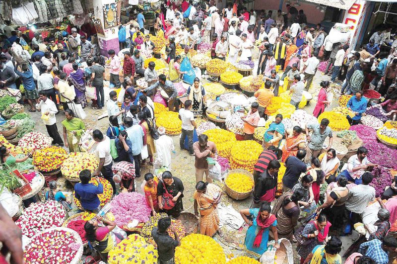 People shopping on the eve of Varamahalakshmi festival at KR Market, in Bengaluru on Thursday
