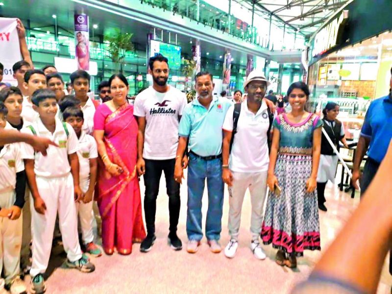 Vihari (fourth from right) is all smiles as he poses with his mother Vijayalakshmi (in red saree), coach John Manoj (third from right), Team India fielding coach R. Sridhar (second from right) and sister Vaishnavi (right) at the airport.