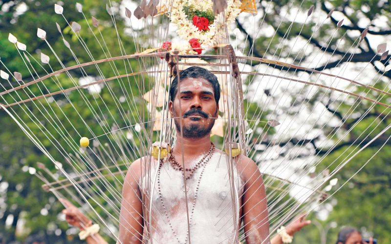 A devotee with his body pierced with metal rods  performs a ritual during â€œAadiâ€ celebrations in Chennai on Sunday. (Photo: AFP)