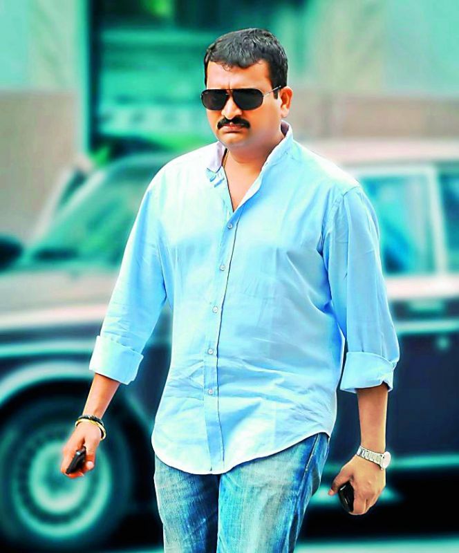 Bandla Ganesh got the Congress party symbol tattooed on his chest.