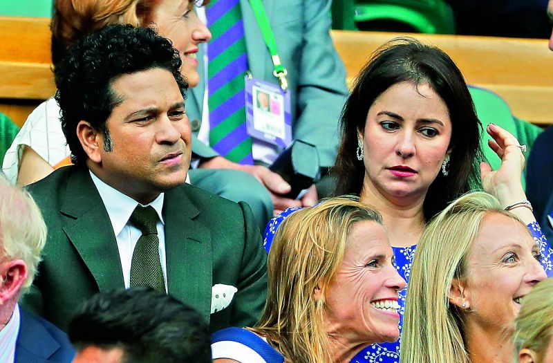 Indian cricket legend Sachin Tendulkar (below) and his wife Anjali take their seats in the Royal Box for the men's semifinal between Cilic and Querrey at Wimbledon on Friday (Photo: Ap)