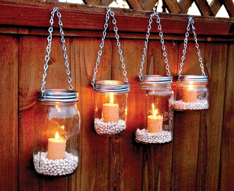  Use old jars for a candle set filled with pebbles that you can hang on a staircase or a railing.