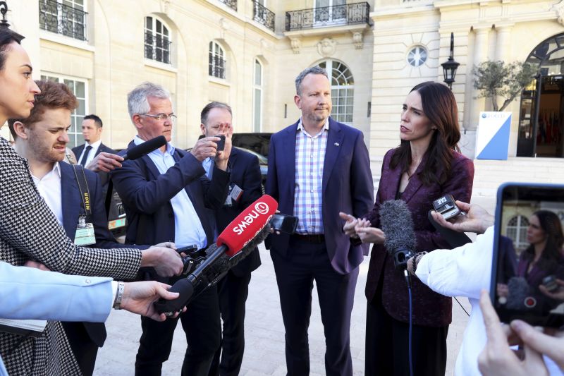 New Zealand Prime Minister Jacinda Ardern, right, gives a press conference, at the OECD headquarters, in Paris, Tuesday, May 14, 2019. The leaders of France and New Zealand will make a joint push to eliminate acts of violent extremism from being shown online, in a meeting with tech leaders in Paris on Wednesday. (AP Photo/Thibault Camus) 