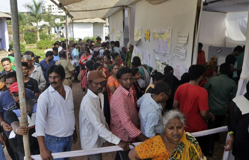 Indian voters line up outside a polling booth in Mumbai, India, Monday, April 29, 2019. Indians were voting Monday in the fourth phase of a staggered national election. (Photo:AP)