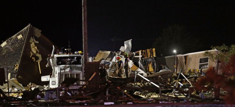 Emergency workers search through debris from a mobile home park, Sunday, May 26, 2019, in El Reno, Ok., following a likely tornado touchdown late Saturday night. (AP Photo/Sue Ogrocki) 