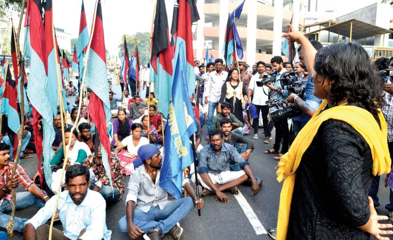 Hartal activists block the road in front of the Ponnara Park in Thampanoor.