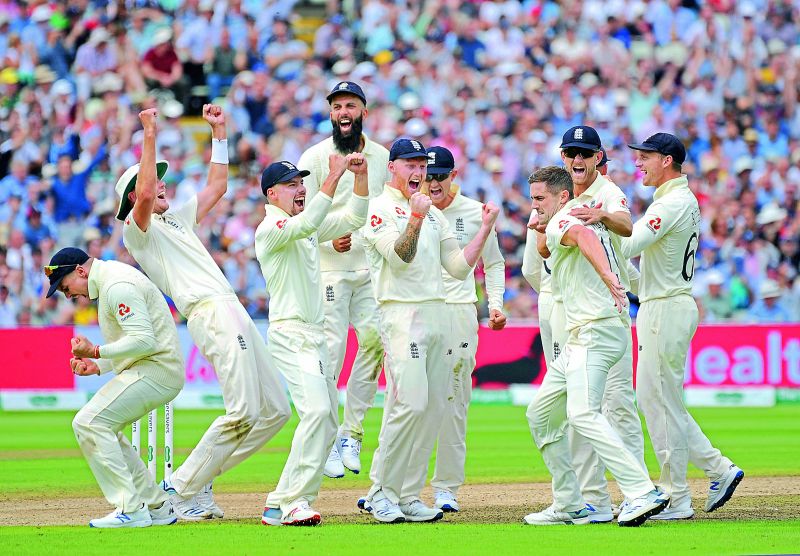 England cricketers celebrate after a successful review decision for the dismissal of Australian batsman Matthew Wade during the first day of the first Ashes Test at Edgbaston ground in Birmingham, England, on Thursday. (Photo: AP)