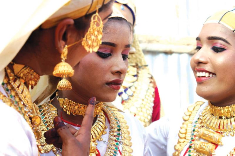 A co-dancer tries to cheer up Sukanya (left). 