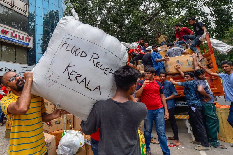 Volunteers segregate flood relief material donated by general public to be sent to Kerala, in Chennai on Sunday. (Photo: PTI)