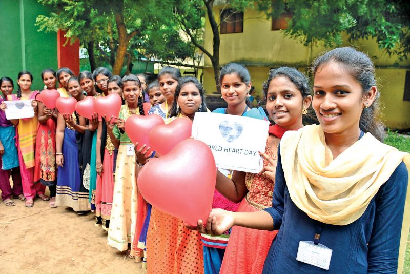 Students from Kumara Rani Meena Muthiah College on Thursday undertake a pledge to create awareness on heart diseases to mark the World Heart Day. (Photo: DC)