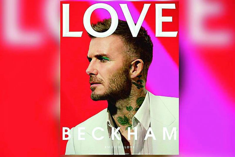 Former footballer David Beckham sporting green eyeliners for the cover of Love Magazine.