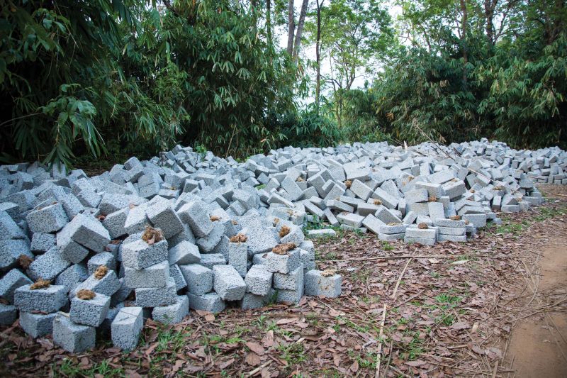 30,000 cement concrete blocks brought to construct houses lie unused by the wayside.