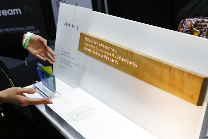 The mui calm design device is on display at the mui booth during CES Unveiled at CES International, Sunday, Jan. 6, 2019, in Las Vegas. The interactive device allows the user to control devices such as home lighting and thermostats via touch and voice command. (AP Photo/John Locher)