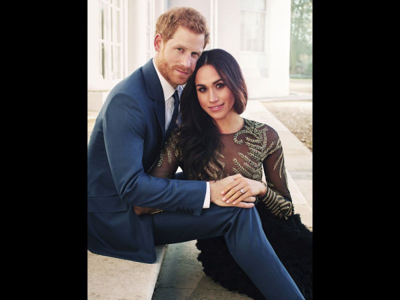 In this photo released by Kensington Palace on Thursday, Dec. 21, 2017, Britain's Prince Harry and Meghan Markle pose for one of two official engagement photos, at Frogmore House, in Windsor, England. (Alexi Lubomirski / AP)