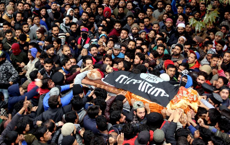 Mughees Ahmed Mir's body was wrapped in an ISIS flag at his funeral, which was attended by thousands of mourners. (Photo: HU Naqash)