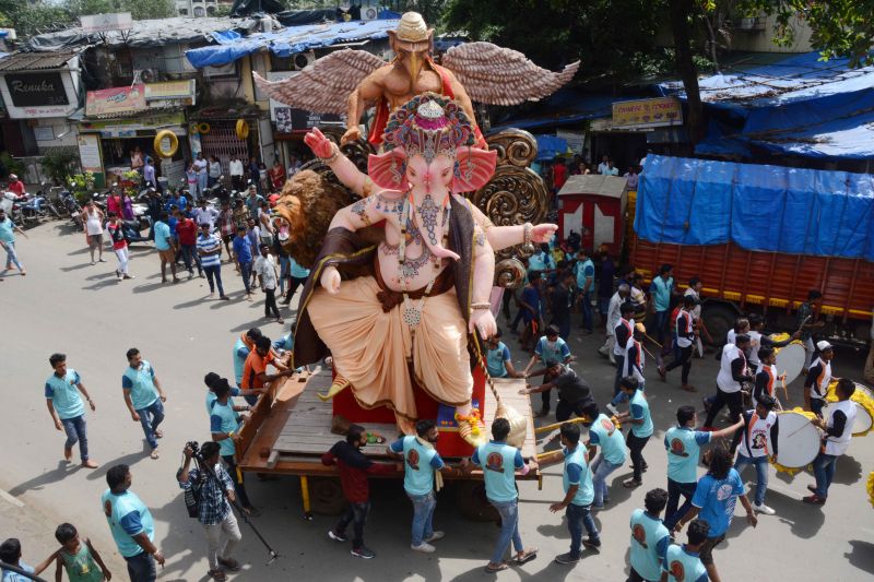 Eco Friendly Ganesha Devotees of Sri Siddhivinayak Mandal Sakinaka carry a 21 feet Lord Ganeha Idol made out 75 kg Tissue paper and glue idol carry from Andheri to Sakinaka, Mumbai. (Photo: Mrugesh Bandiwadekar)