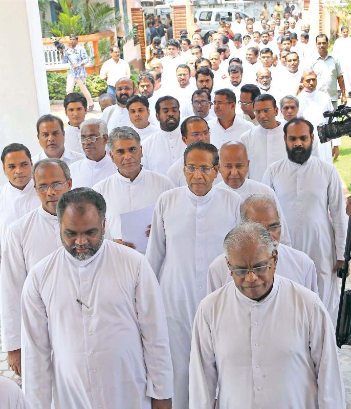 Priests take out a protest march to the Major Archbishop's House in Kochi on Friday.