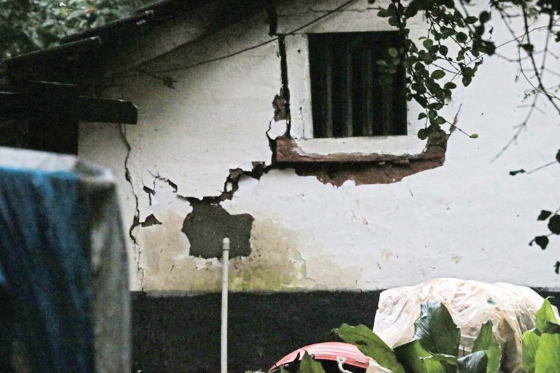 A house at Iggudlu village near Madapura develops cracks after a massive landslide just  50 metres away from it