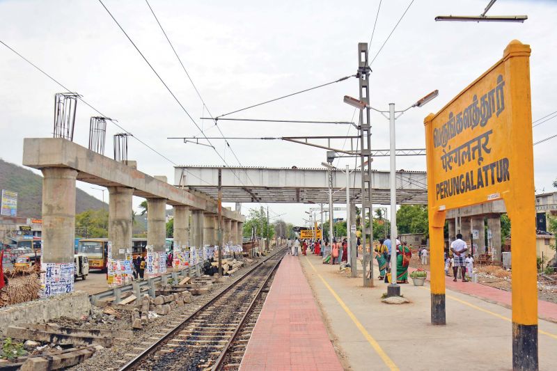 Construction of flyover near Perungalathur railway station remains incomplete, causing hardship to motorists. (Photo: DC)