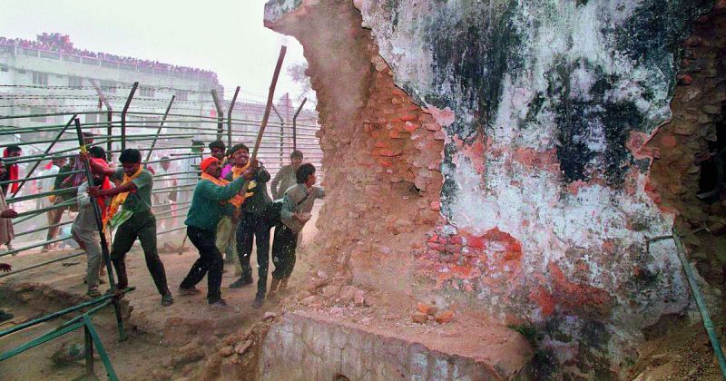 Hindu fundamentalists attack the wall of the 16th century Babri Masjid with iron rods on December 6, 1992  AFP