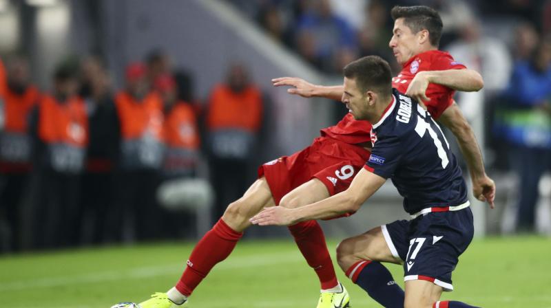 Bayern Munichs Robert Lewandowski scored a landmark 200th goal for the club as they kicked off their Champions League campaign by easing to a 3-0 victory over Red Star Belgrade on Wednesday in a one-sided Group B encounter. (Photo:AP)