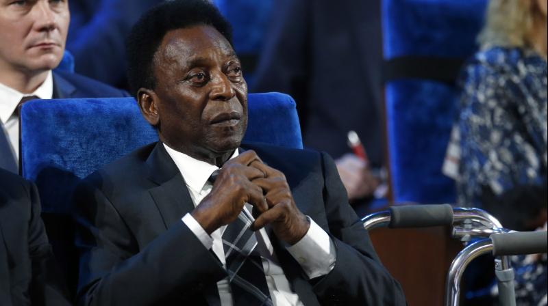 Pele, who won three World Cups with Brazil in 1958, 1962 and 1970, has been struggling with ill health and Monday as his first public appearance with a zimmer frame, having ttended Decembers World Cup draw in a wheelchair. (Photo: AP)