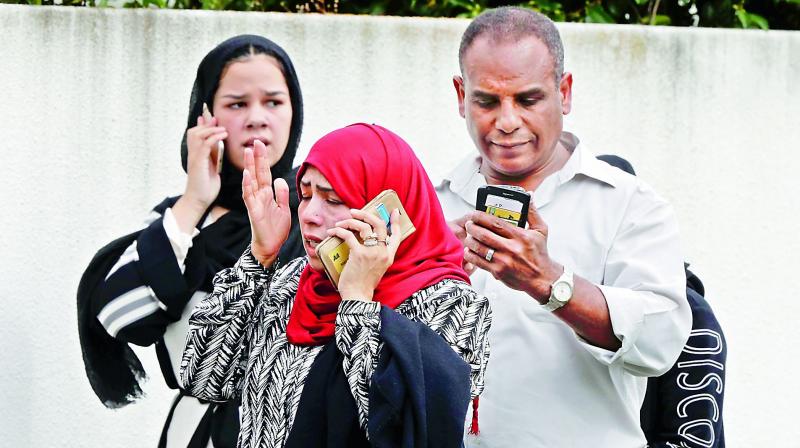 A man reacts as he speaks on a mobile phone near a mosque in central Christchurch, New Zealand, on Friday. 49 people were killed in mass shootings at two mosques full of people attending Friday prayers as New Zealand police warned people to stay indoors as they tried to determine if more than one gunman was involved. (Photo: AP)