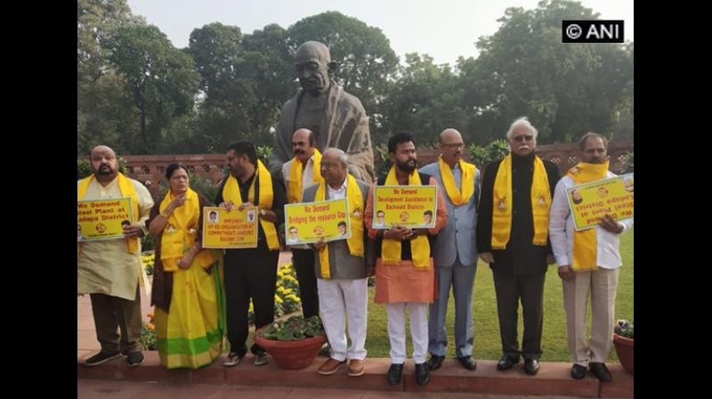 As part of protest, scores of TDP leaders were seen walking with placards and festoons through streets displaying various reasons and factors as to why Andhra should be given special status. (Photo:ANI)