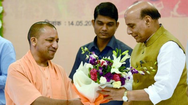HM Rajnath Singh met UP CM Yogi Adityanath to oversee preparations for the celebration of International Yoga Day on June 21,in Lucknow. (Photo: ANI/Twitter)