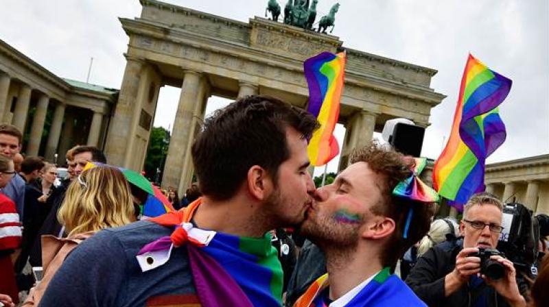 Berlin mayor Michael Mueller congratulated the happy couples and described the first gay nuptials as a \historic event\. (Photo: AFP)