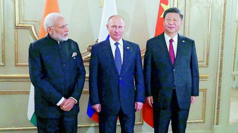 Prime Minister Narendra Modi, left, Russian President Vladimir Putin, center, and Chinese President Xi Jinping, during their meeting at the G20 summit in Buenos Aires, Argentina. (AP/PTI)