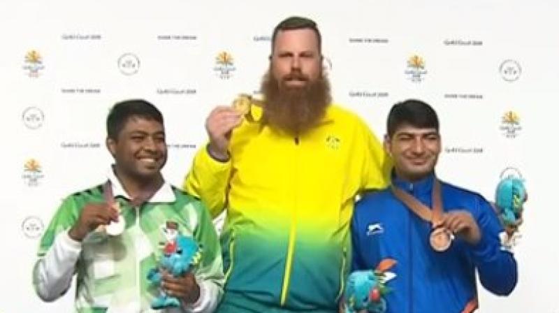 Mitharval conceded the lead in the following round with a 7.2 and 7.6, going down from gold to silver and finally settling for bronze. (Photo: Twitter / IOA)