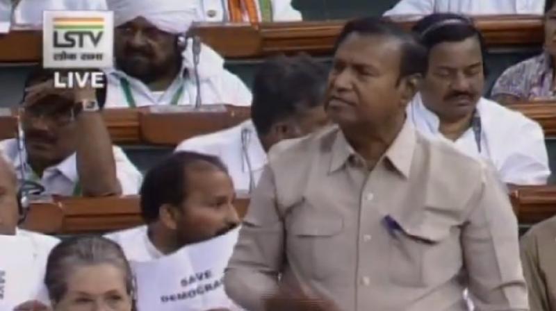 K\taka Congress MPs raise \Save Democracy\ slogans in LS