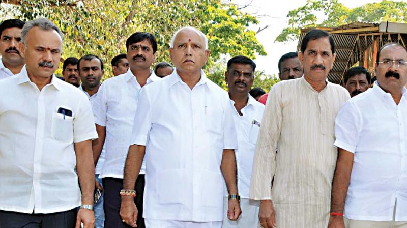 State BJP president B.S. Yeddyurappa and other leaders of the party at Siddaganga Matha in Tumakuru on Thursday before visiting Sri Shivakumara Swami who is undergoing treatment there 	 KPN