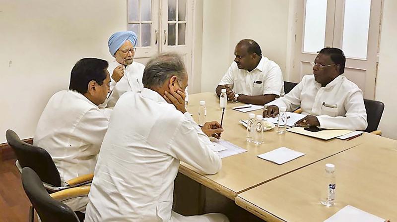 Former PM Manmohan Singh with MP CM Kamal Nath, Rajasthan CM Ashok Gehlot, Karnataka CM H.D. Kumaraswamy and  Puducherry CM V. Narayansamy during a meeting in New Delhi on Saturday. (Photo: PTI)