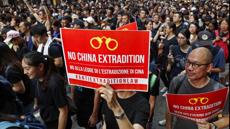 Protests still underway despite suspension of controversial bill in Hong Kong