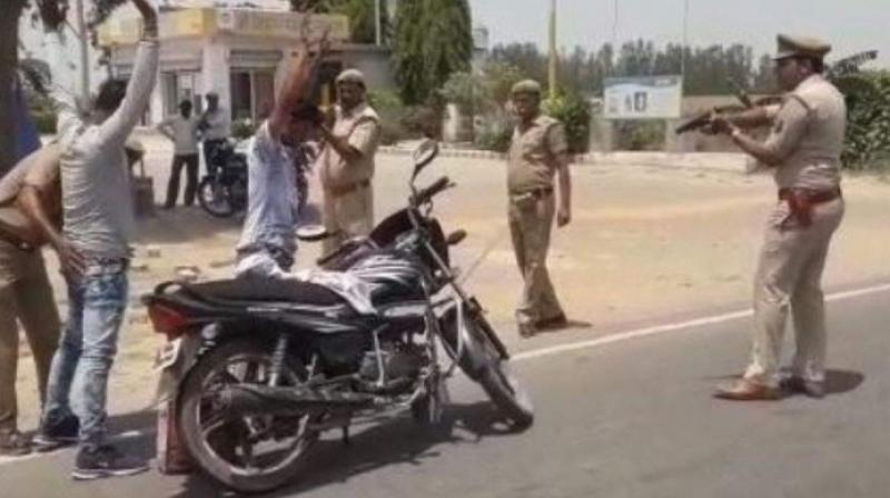 Hands up! UP\s Badaun police frisk people at gunpoint, see video